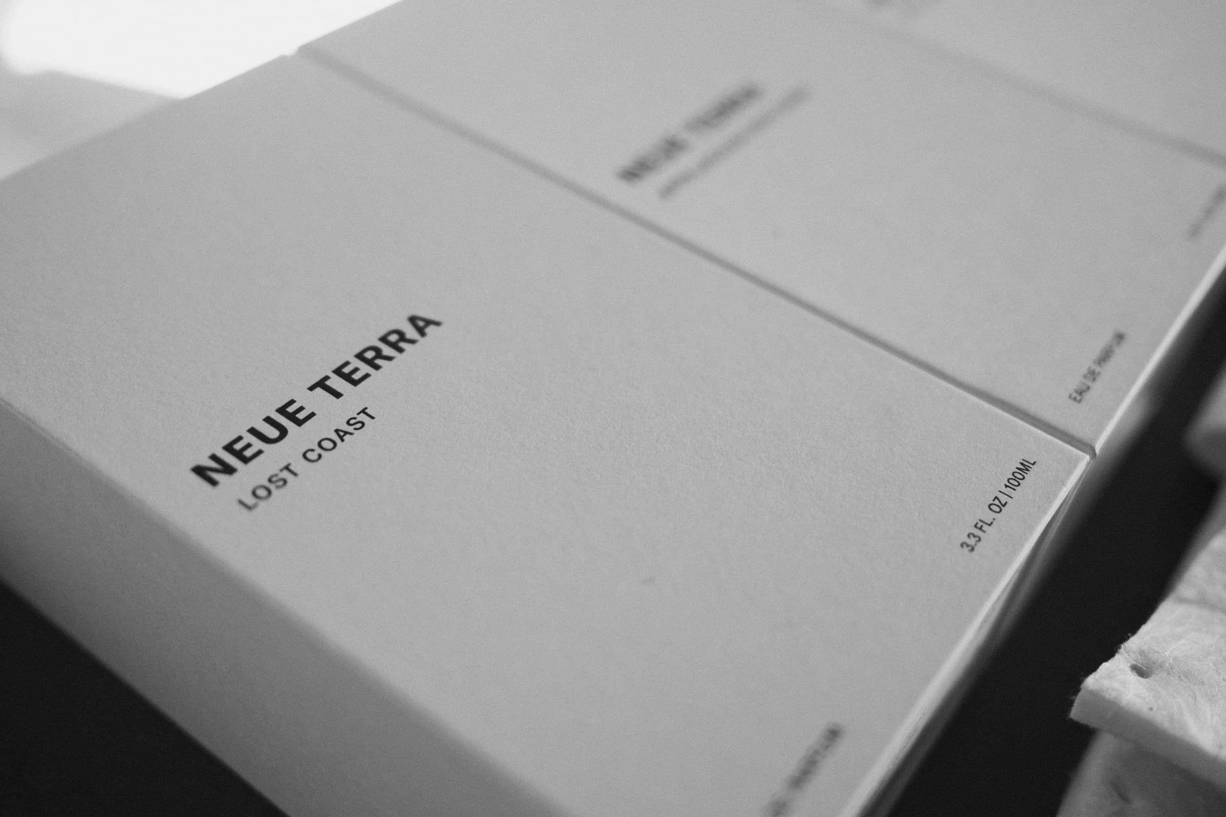 Two white Neue Terra Lost Coast presentation boxes